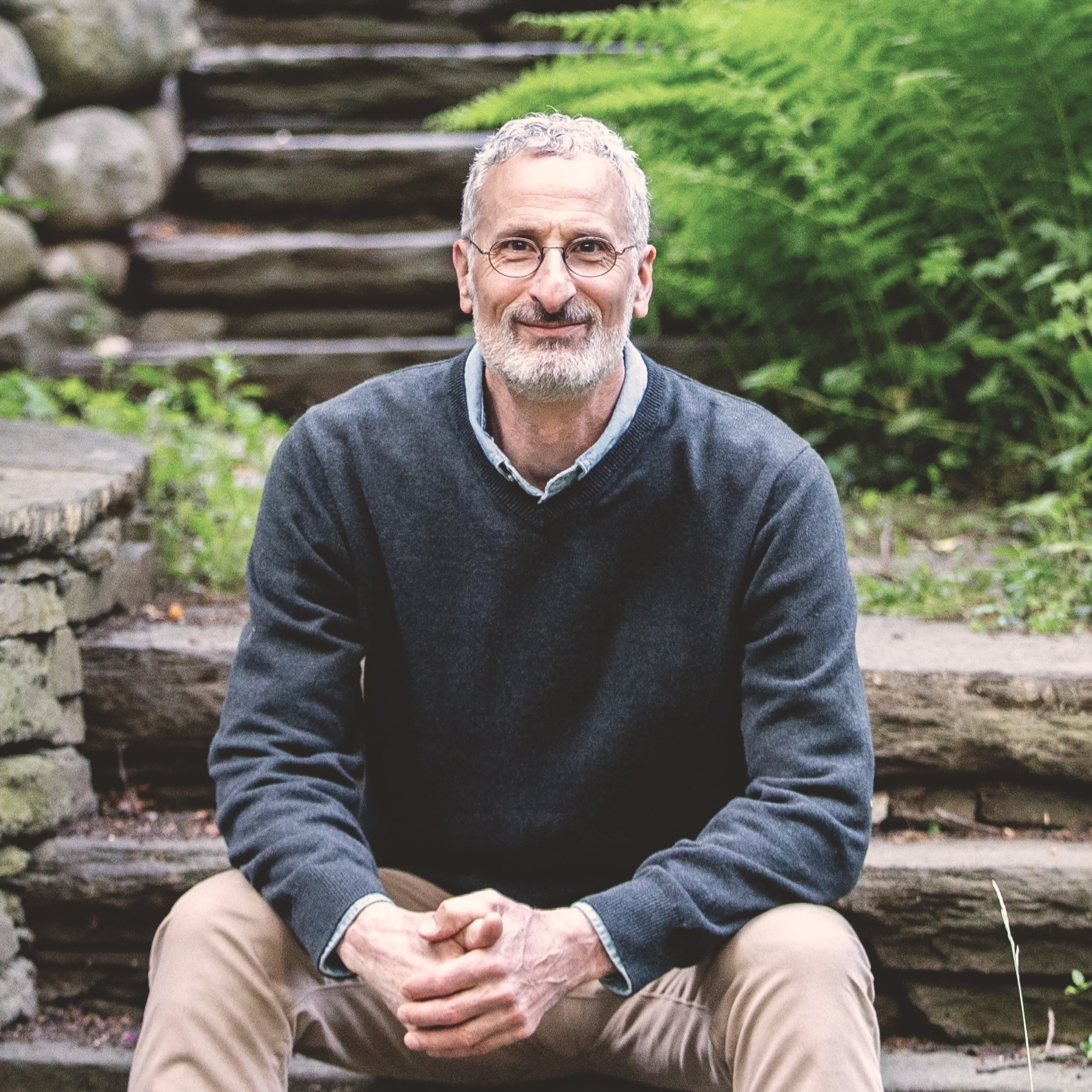 Jonathan Homepage headshot Cropped Jonathan Stein transformational life coach sitting in relaxing quiet setting